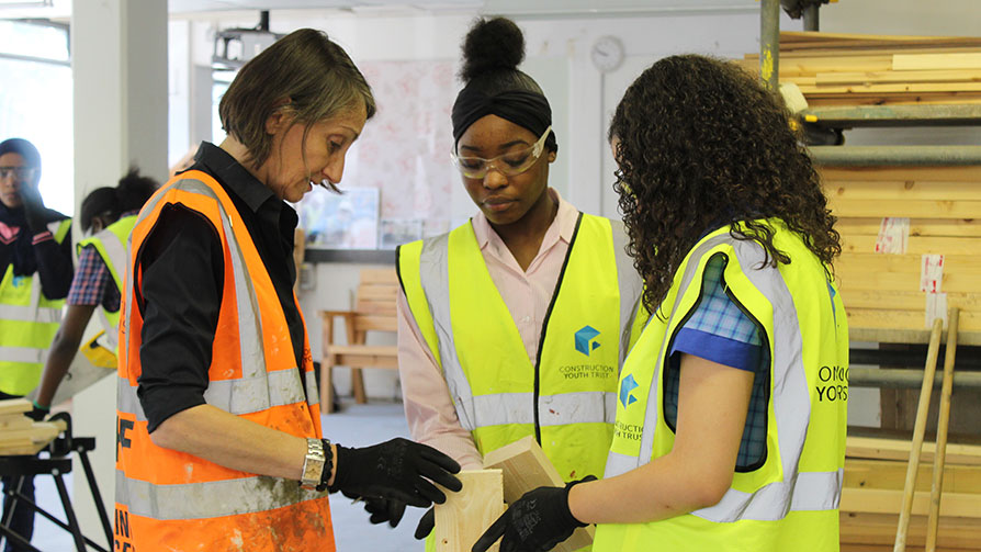 Female teacher with students - Construction Youth Trust Female teacher with students - Construction Youth Trust