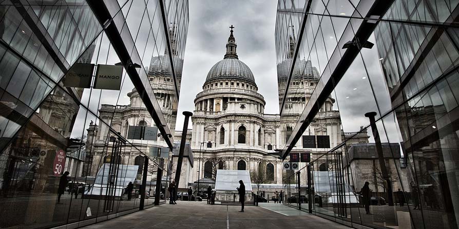 Modern architecture in London with people on the streets