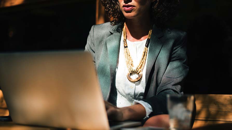Woman completing a building regulations application online on a laptop Woman completing a building regulations application online on a laptop