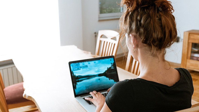 Woman on a laptop starting a building regulations application