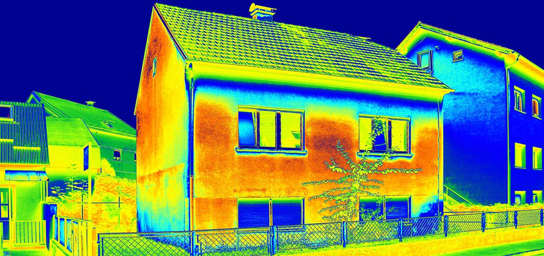 Picture of home showing heat loss taken by thermal camera