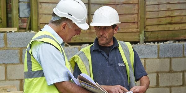 Two men on building site in hard hats - LABC Partner Authority Scheme
