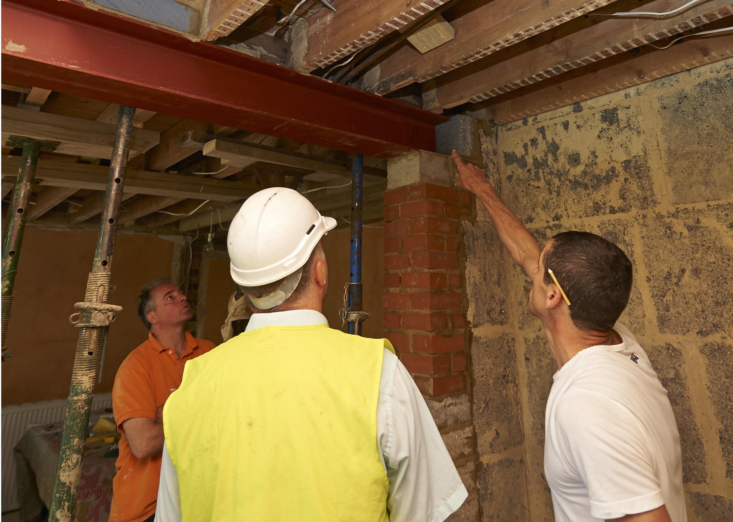 Builder and building control officer on site