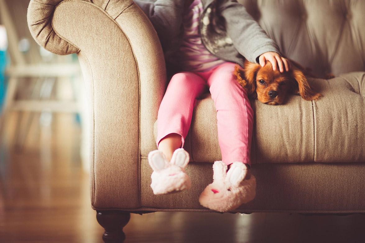 Girl sitting on sofa - Inquiry into the Quality of New Build Housing in the UK