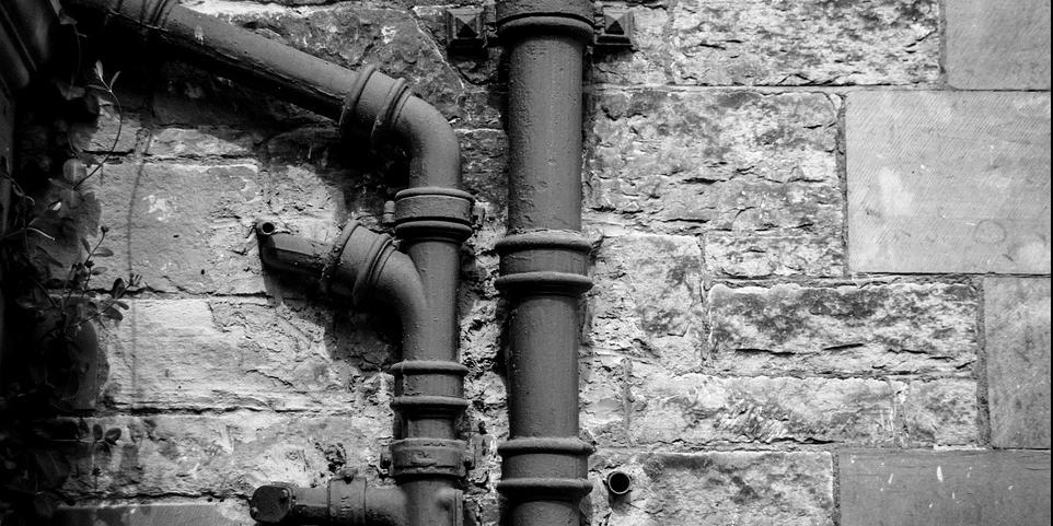 Picture of drainage pipework on wall