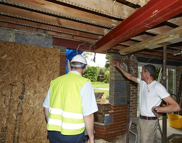 building control surveyor on building site