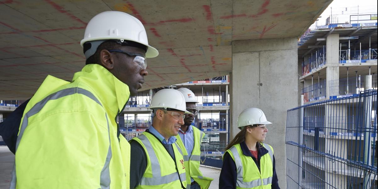 What is a building control officer? Picture showing four building control officers.