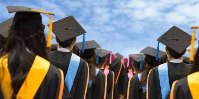 Building control degree graduates in academic gowns