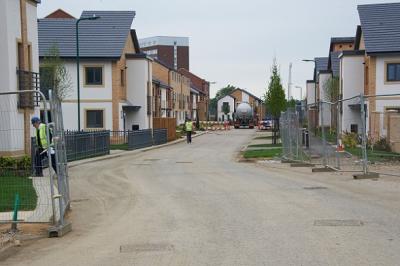 Construction site of nearly completed new housing.