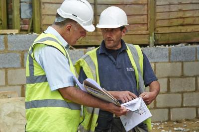 Two men on building site in hard hats - LABC Partner Authority Scheme