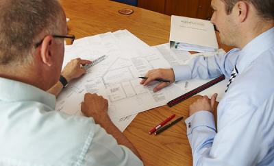 Picture of two designers looking at plans - BEPE 