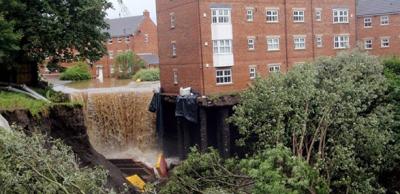 Ground collapse beside building