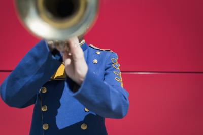 Trumpeter with trumpet and pink wall