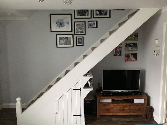 tv under stairs